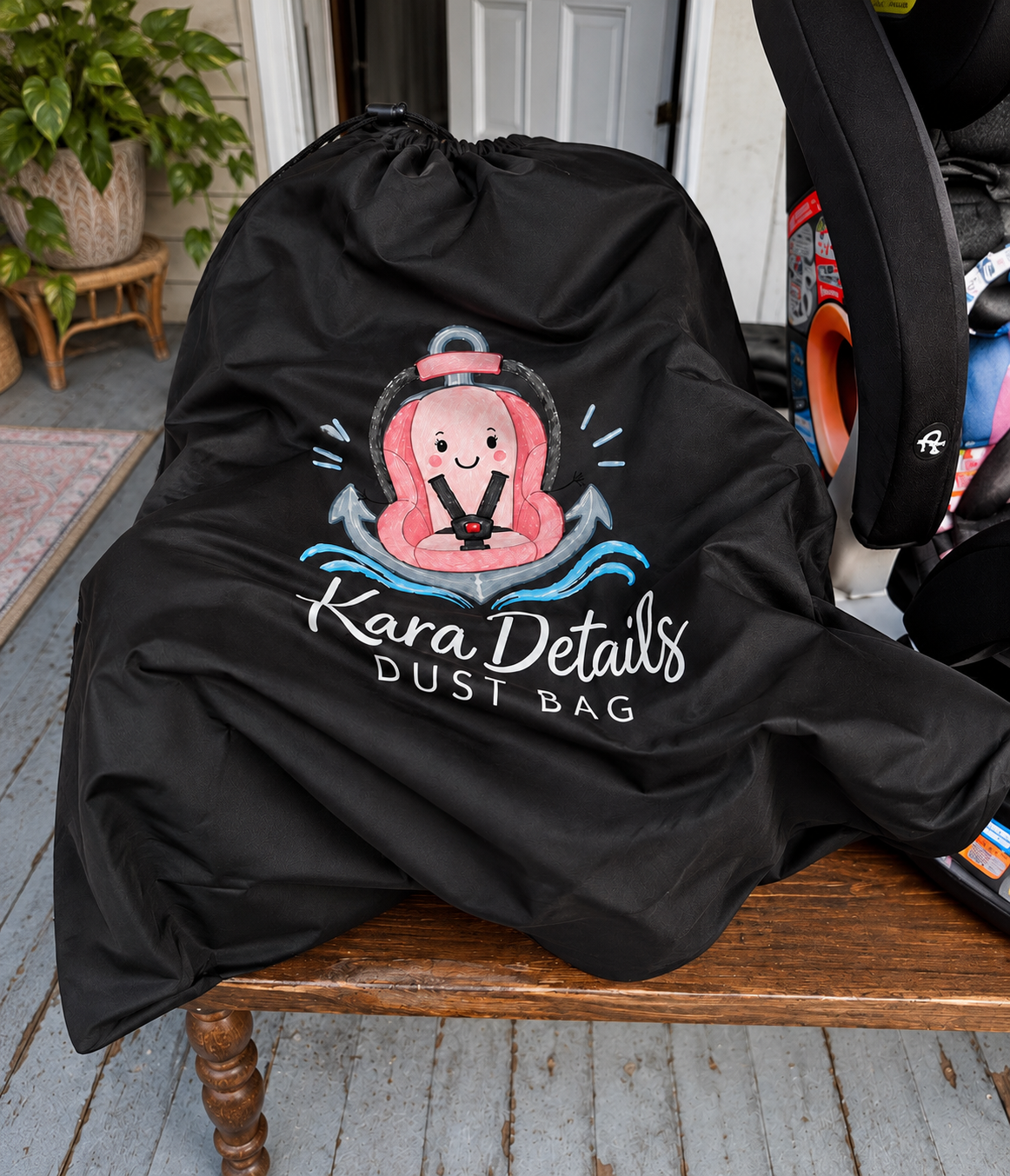 Black Kara Details Dust Bag on a car seat
